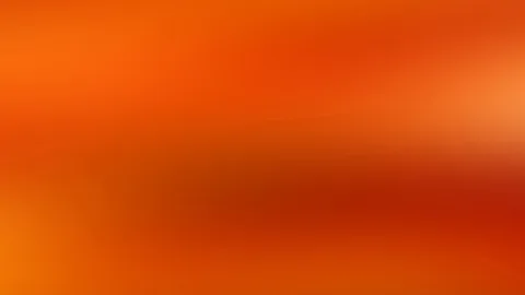 Unscharfer Verlauf in Orange und Rot mit helleren Lichtflecken am rechten Rand und dunkleren Rottönen in der Mitte.
