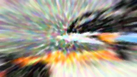 Abstraktes Bild mit bunten Farben, die von der Mitte nach außen wie Strahlen auseinanderlaufen, dunkle Flächen rechts oben und ein helles Blau rechts.