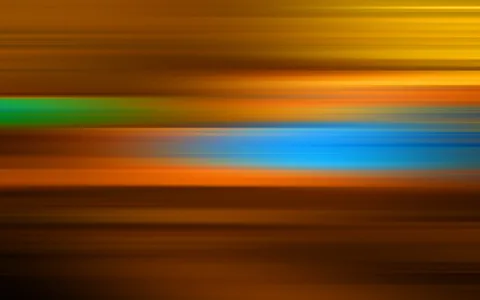 Verwischte horizontale Streifen in Gelb, Orange, Grün, Blau und Braun, die von oben nach unten ineinander übergehen.