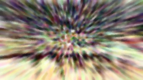 Abstrakte, radial verwischte Farbstreifen in Grün, Violett und Gelb, die von einem hellen Zentrum nach außen laufen.
