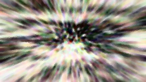 Abstraktes Bild mit radial von einem dunklen Zentrum nach außen verlaufenden, bunt schimmernden Streifen in Grün, Rosa, Weiß und Violett, leicht pixelig verwischt.