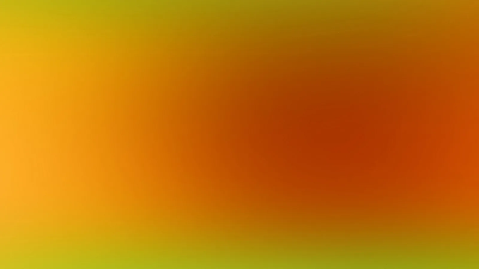 Unscharfer Verlauf von Gelb und Gelbgrün am Rand zu Orange und Rotbraun in der Bildmitte.