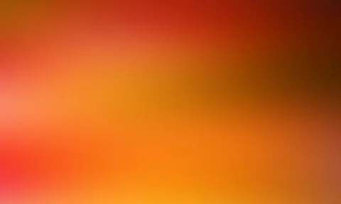 Weicher Farbverlauf von Rot oben links über Orange bis Gelb unten rechts, rechts oben dunkel braunrot.