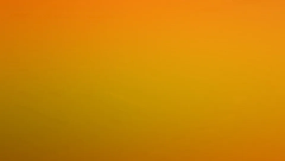 Flächiger Farbverlauf von kräftigem Orange oben zu Gelb und Ocker unten, ohne erkennbare Motive.
