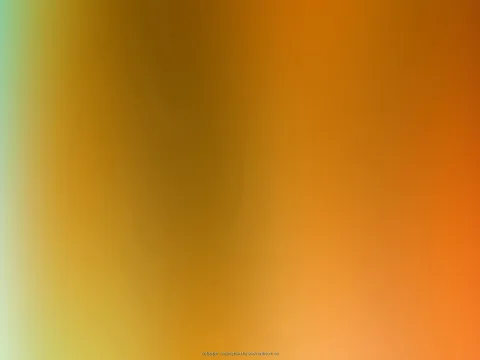 Weich verschwommene Farbfläche mit Orange, Gelb und Grün, in der Mitte ein dunklerer Bereich.