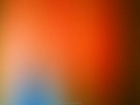 Unscharfer Farbverlauf von Orange über Rot bis Dunkelbraun, unten links ein blauer Lichtfleck.