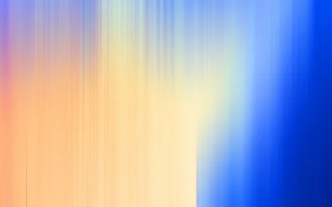 Abstrakter Farbverlauf aus senkrechten, unscharfen Streifen in Orange, Gelb und Hellblau, rechts in tiefes Blau übergehend.