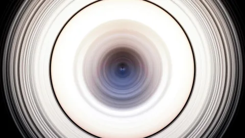 Konzentrische Kreise aus weißen, grauen und blauen Schlieren, die sich zur Mitte hin verdichten, umgeben von Schwarz.