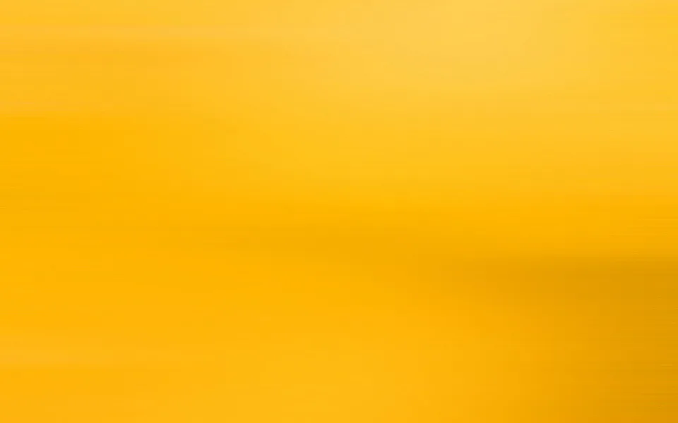 Horizontal verwischte Striche in Gelb und Orange, die von hellem Gelb oben zu dunklerem Honiggelb unten übergehen.