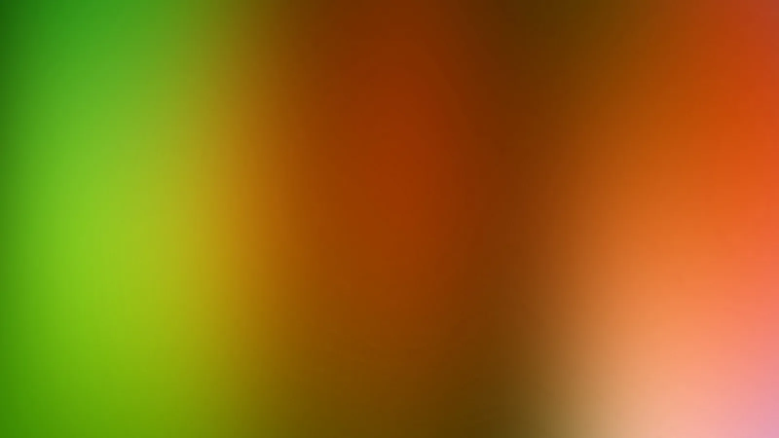 Unscharfer Farbverlauf von Grün links über Braunorange in der Mitte bis zu Orange und Rosa rechts.
