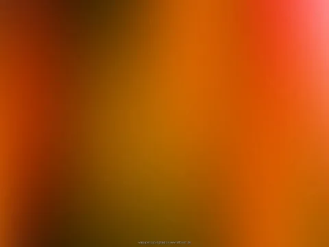 Unscharfer Farbverlauf aus Orange, Rot und Dunkelbraun, oben rechts ein heller rosa Lichtfleck.