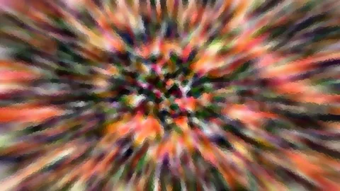 Abstraktes Bild mit farbigen Streifen in Orange, Rot, Grün und Pink, die von einem dunklen Zentrum radial nach außen laufen, grob gepixelt.