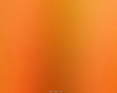 Weicher orangefarbener Farbverlauf mit dunkleren, senkrechten Schlieren in der Bildmitte.