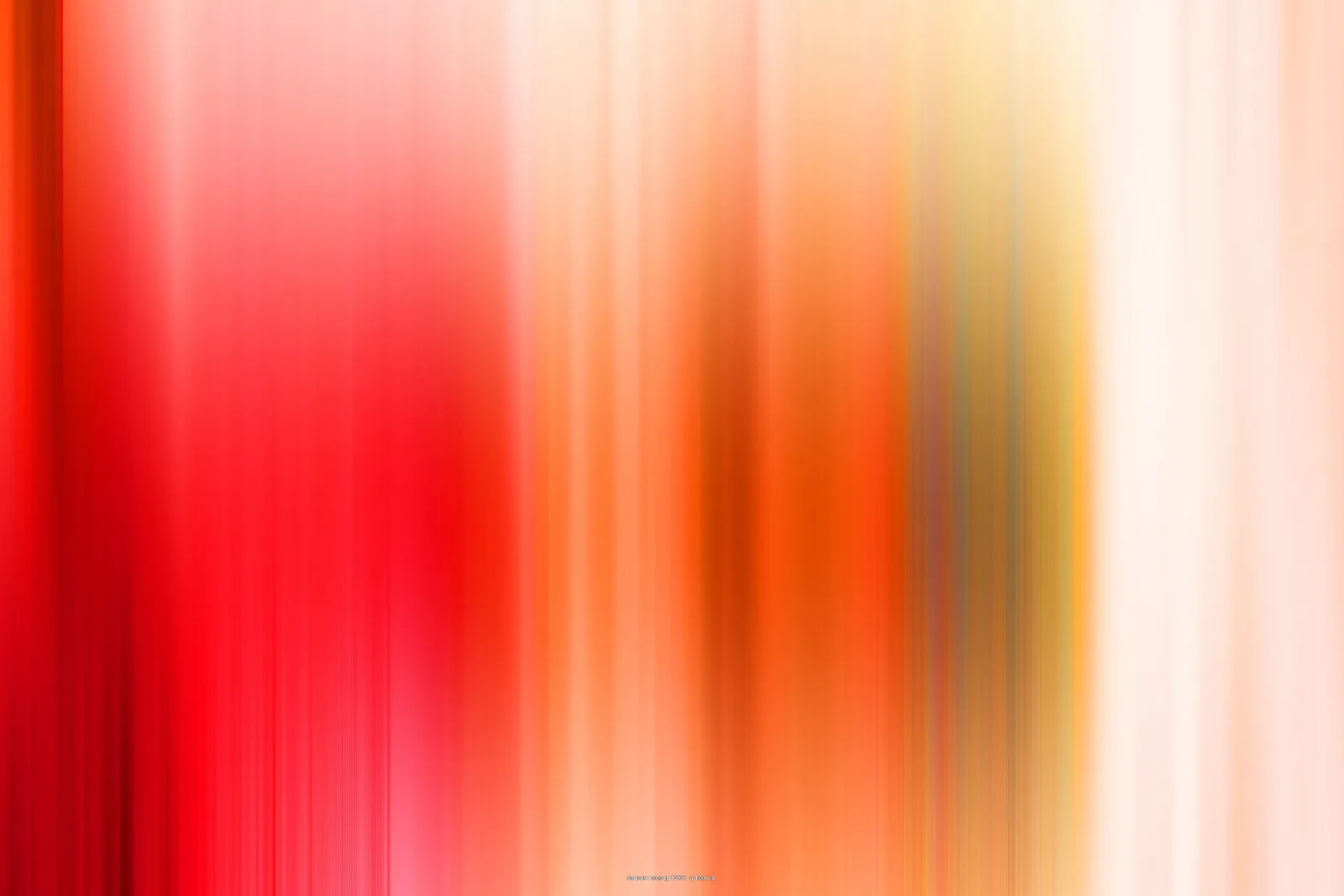 Verschwommene vertikale Streifen in Rot, Orange, Gelb und hellem Creme, die von links nach rechts ineinander übergehen.