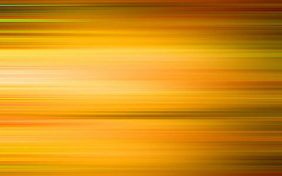Abstrakte horizontale Streifen in Orange, Gelb und Rot mit weichen Übergängen, die von Bewegungsunschärfe wirken.
