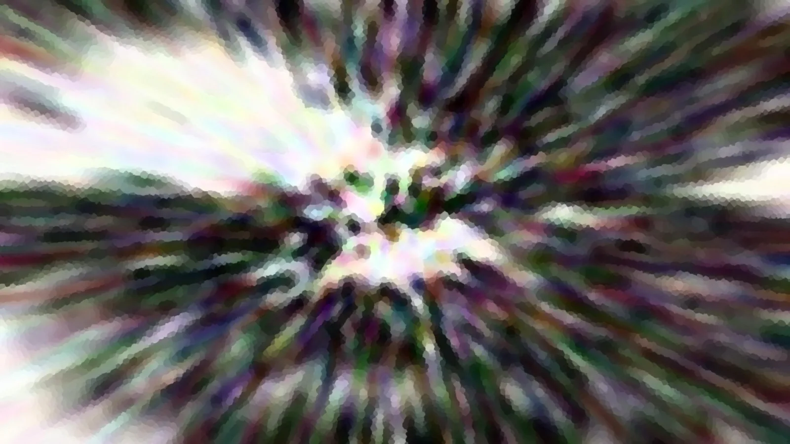 Abstrakte Zoomaufnahme mit radialen Farbstreifen in Grün, Lila und Weiß, im Zentrum ein heller Lichtfleck.