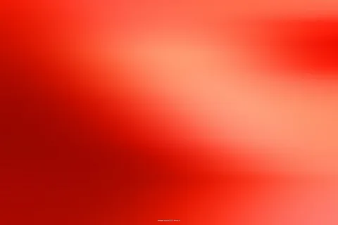 Unscharfer Verlauf in Rot und Orange, links dunkler, rechts heller mit einem hellen Bereich in der Bildmitte oben.