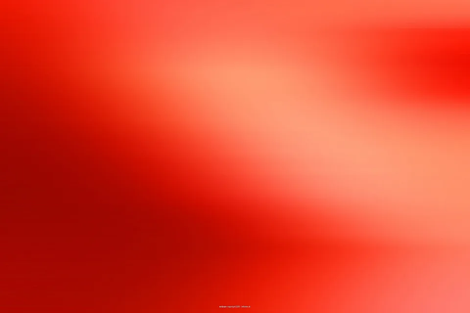 Unscharfer Verlauf in Rot und Orange, links dunkler, rechts heller mit einem hellen Bereich in der Bildmitte oben.