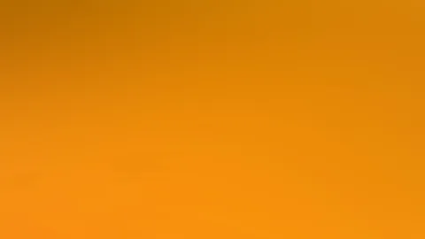 Weicher Farbverlauf in Orange, oben dunkler und unten heller, ohne erkennbare Motive.