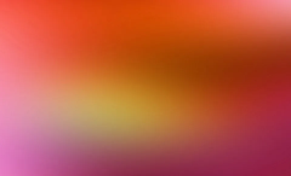 Unscharfer Farbverlauf von Orange über Gelb bis Magenta, oben hell orange, unten violett-rosa.