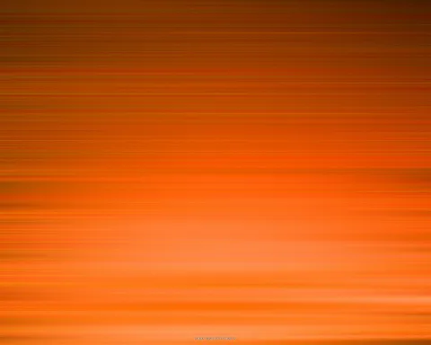 Horizontale, verwischte Streifen in Orange und Rotorange, die oben dunkler und unten heller werden.