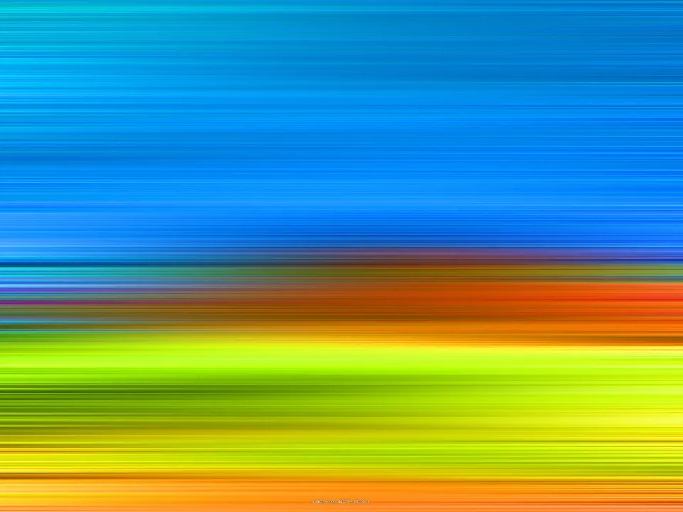 Horizontal verwischte Streifen: oben dominiert Blau, darunter folgen Orange, Gelbgrün und ein orangefarbener Streifen am unteren Rand.