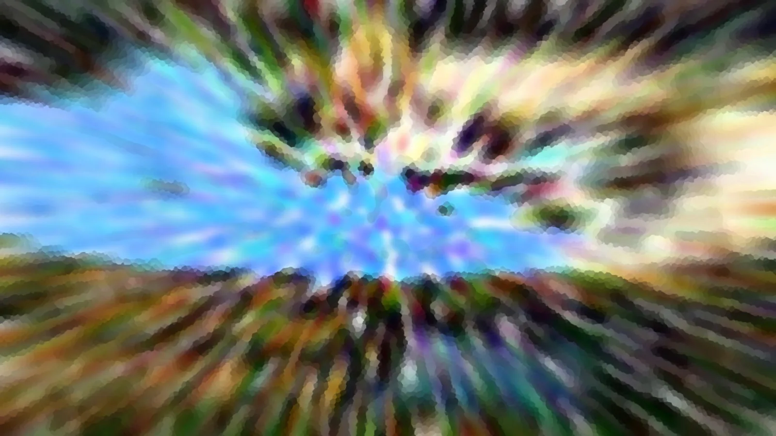 Radial verwischte Landschaft mit blauem Himmel in der Mitte und bunten Schlieren aus Grün, Gelb und Braun an den Rändern