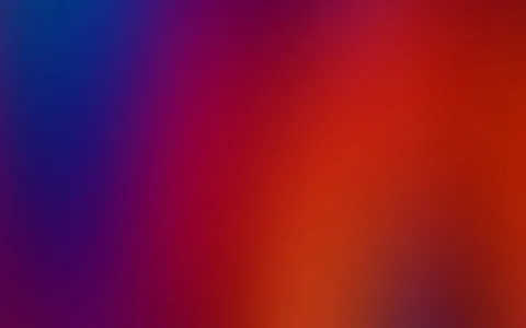Unscharfer Farbverlauf von Blau links über Violett und Rot bis zu Orange rechts unten.
