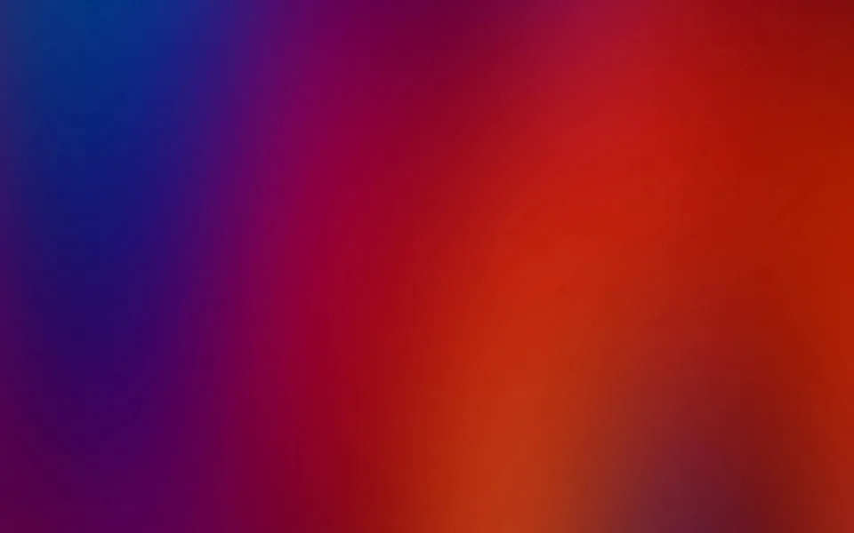 Unscharfer Farbverlauf von Blau links über Violett und Rot bis zu Orange rechts unten.