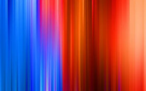 Vertikale, verwischte Streifen laufen von Blau über Violett und Rot bis Orange und Hellorange nebeneinander.