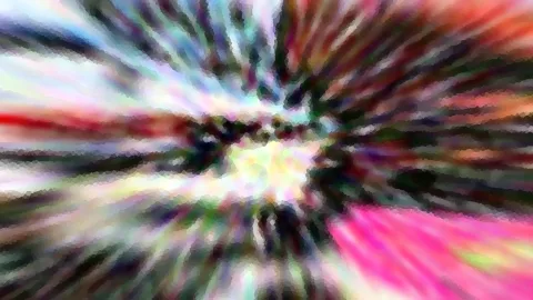 Abstraktes Bild mit radialer Bewegungsunschärfe in Pink, Rot, Grün und Weiß, die von einer hellen Mitte nach außen strahlen.