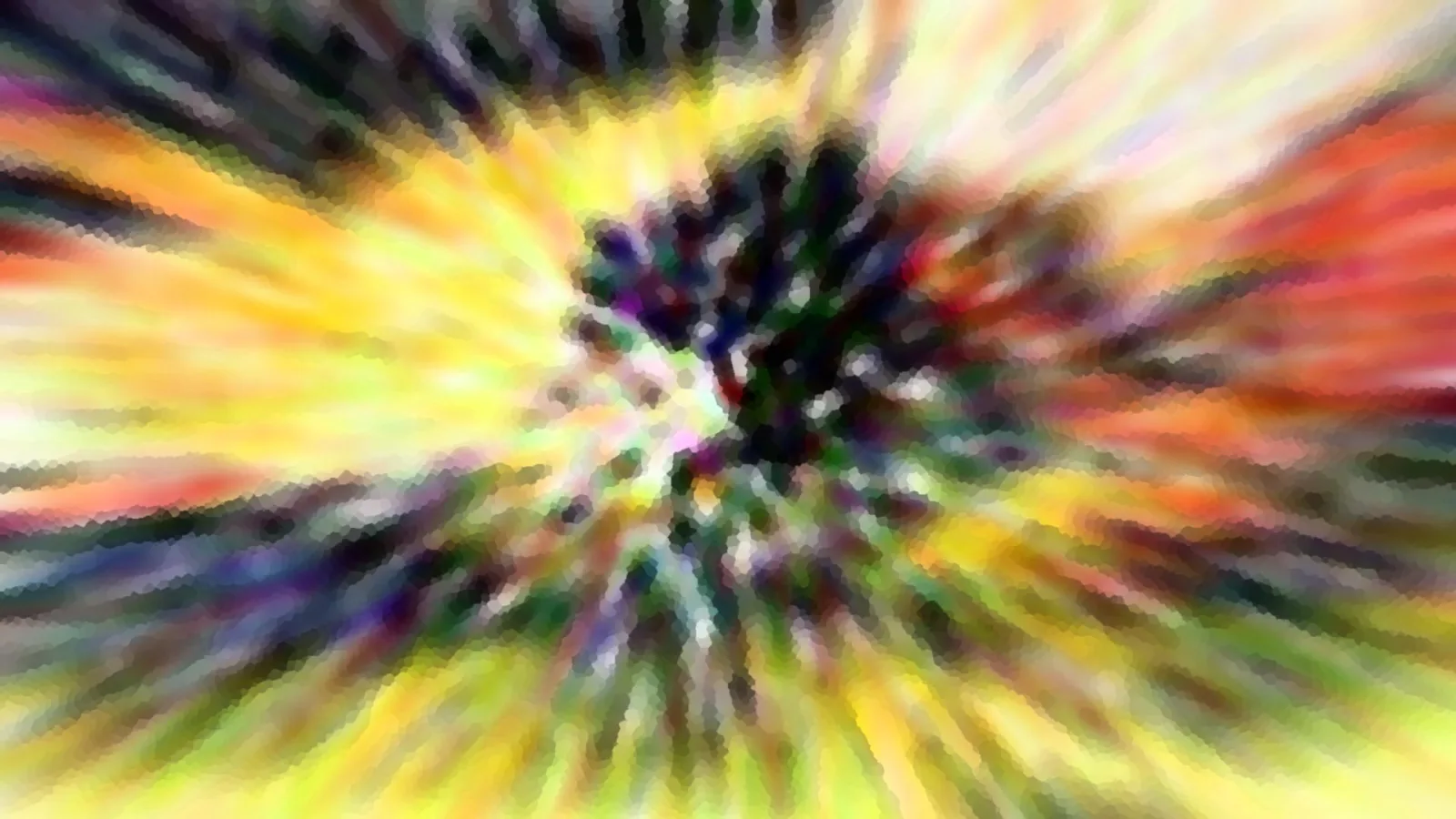Abstrakte Unschärfe: bunte Streifen laufen radial von einem dunklen, fleckigen Kern in der Bildmitte nach außen auseinander.