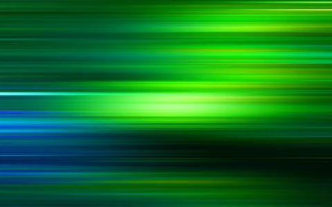 Horizontale grüne, gelbe und blaue Lichtstreifen mit Bewegungsunschärfe auf dunklem Grund
