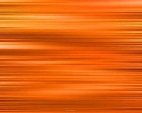Abstrakte Fläche aus waagerechten, unscharfen orangefarbenen Linien mit hellen und dunklen Streifen.