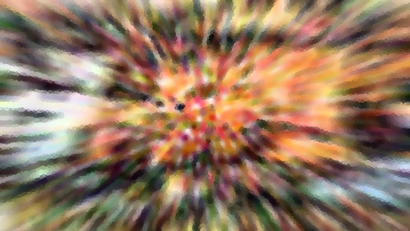 Abstrakte, unscharfe Farbexplosion mit radial von der Mitte ausgehenden Strahlen in Orange, Grün und Gelb