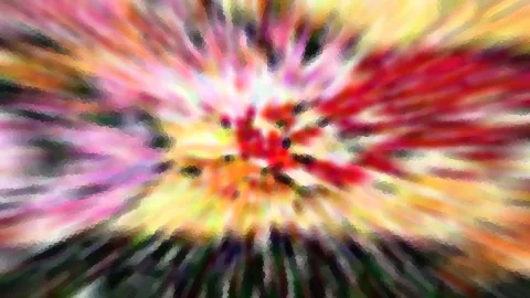 Abstraktes Bild mit farbiger Radialunschärfe in Rot, Gelb, Rosa und Grün, die von einem hellen Zentrum nach außen strahlt.