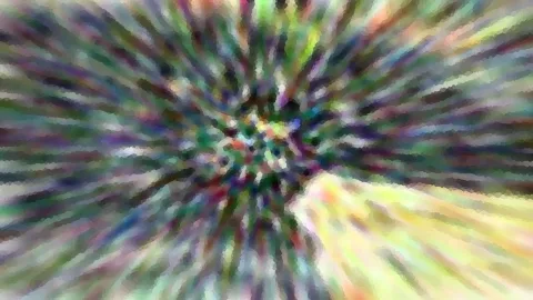 Abstrakte Komposition aus bunten Farbstrahlen, die von einem hellen Zentrum in der Bildmitte radial nach außen laufen, mit mosaikartig gepixelter Struktur.