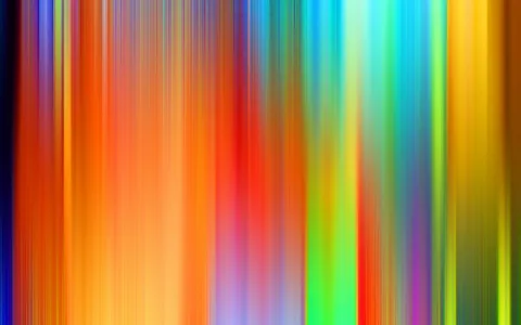 Abstrakte vertikale Streifen in Orange, Gelb, Rot, Grün, Blau und Violett, die ineinander verlaufen und unscharf wirken.