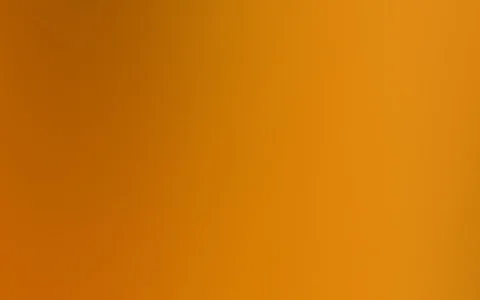 Weicher Farbverlauf in Orange und Bernstein, dunkler am linken oberen Rand und heller nach rechts.