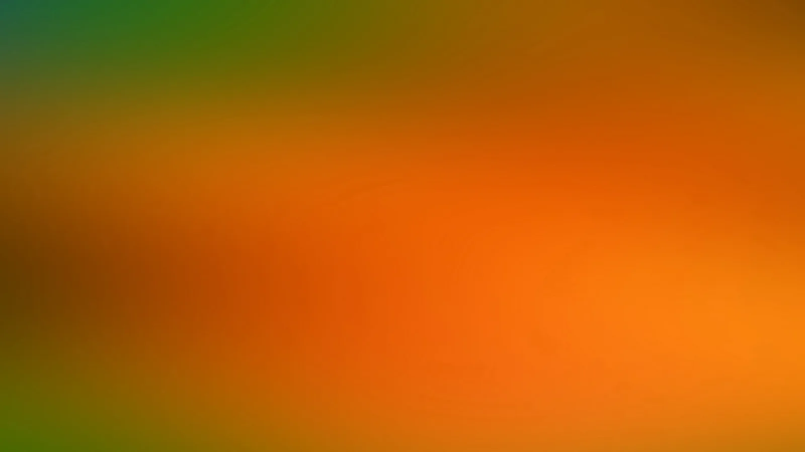 Unscharfer Farbverlauf: Grün oben links geht über Orange in der Mitte und Braun am linken Rand