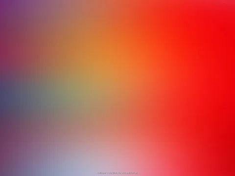Unscharfer Farbverlauf von Rot und Orange rechts oben über Gelb und Grau bis zu Violett und hellem Blau links unten.
