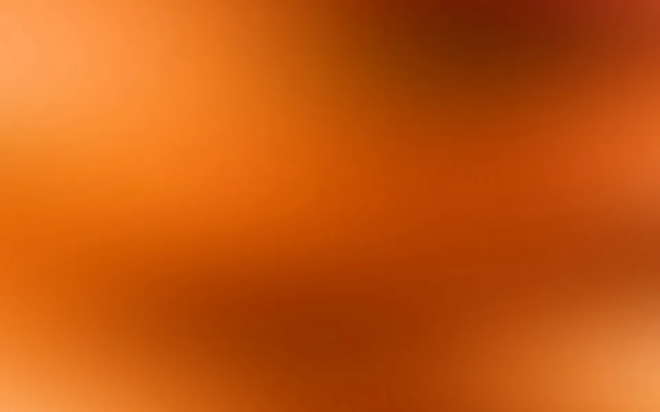 Weicher Farbverlauf von hellem Orange oben links über kräftiges Rostrot bis zu dunklen Brauntönen oben rechts und unten Mitte.