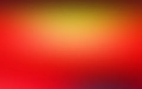 Unscharfer Farbverlauf von Gelb im oberen Bereich über Orange bis Rot, unten dunkler werdend mit violettem Schimmer in der rechten unteren Ecke.