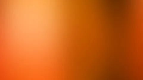 Unscharfer Farbverlauf in Orange und Rotorange, oben links heller, oben rechts ins Braune abgedunkelt.
