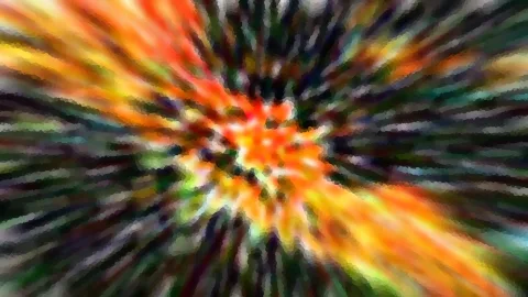Abstrakte radiale Unschärfe mit orangen, gelben und grünen Farbstreifen, die von der Bildmitte nach außen laufen.
