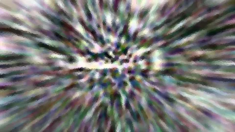 Abstrakte Komposition aus bunten, unscharfen Streifen, die vom Bildmittelpunkt radial nach außen laufen.