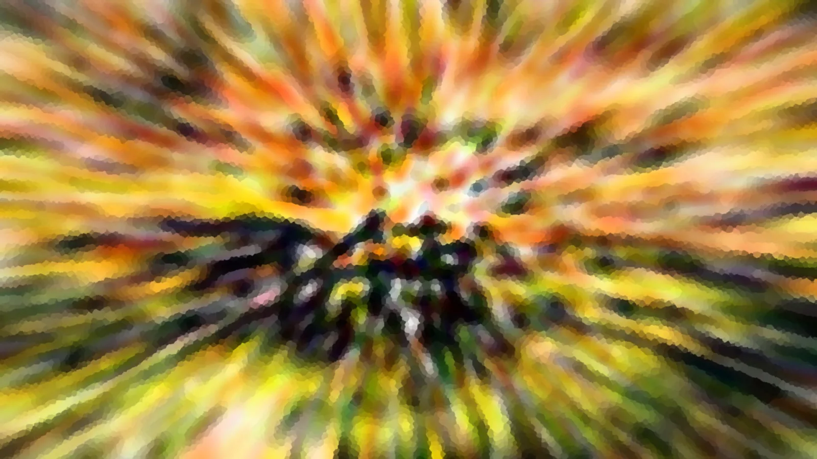 Abstrakte, radial verwischte Farbstrahlen in Orange, Gelb und Grün, die von einem dunklen Zentrum in der Bildmitte ausgehen.