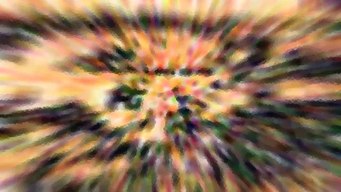 Abstrakte Komposition aus bunten Farbstrahlen in Orange, Gelb, Grün und Violett, die von einem hellen Zentrum radial nach außen laufen und stark verwischt sind.