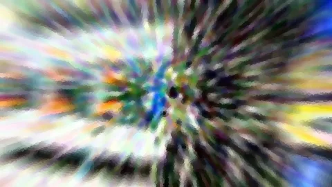 Abstrakte, radial verwischte Farbstrahlen in Blau, Grün, Gelb und Weiß, die von einem hellen Zentrum nach außen laufen.