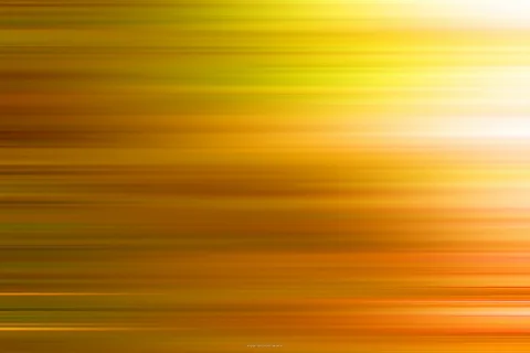 Horizontal verwischte Streifen in Gelb, Orange und Weiß, rechts oben am hellsten.
